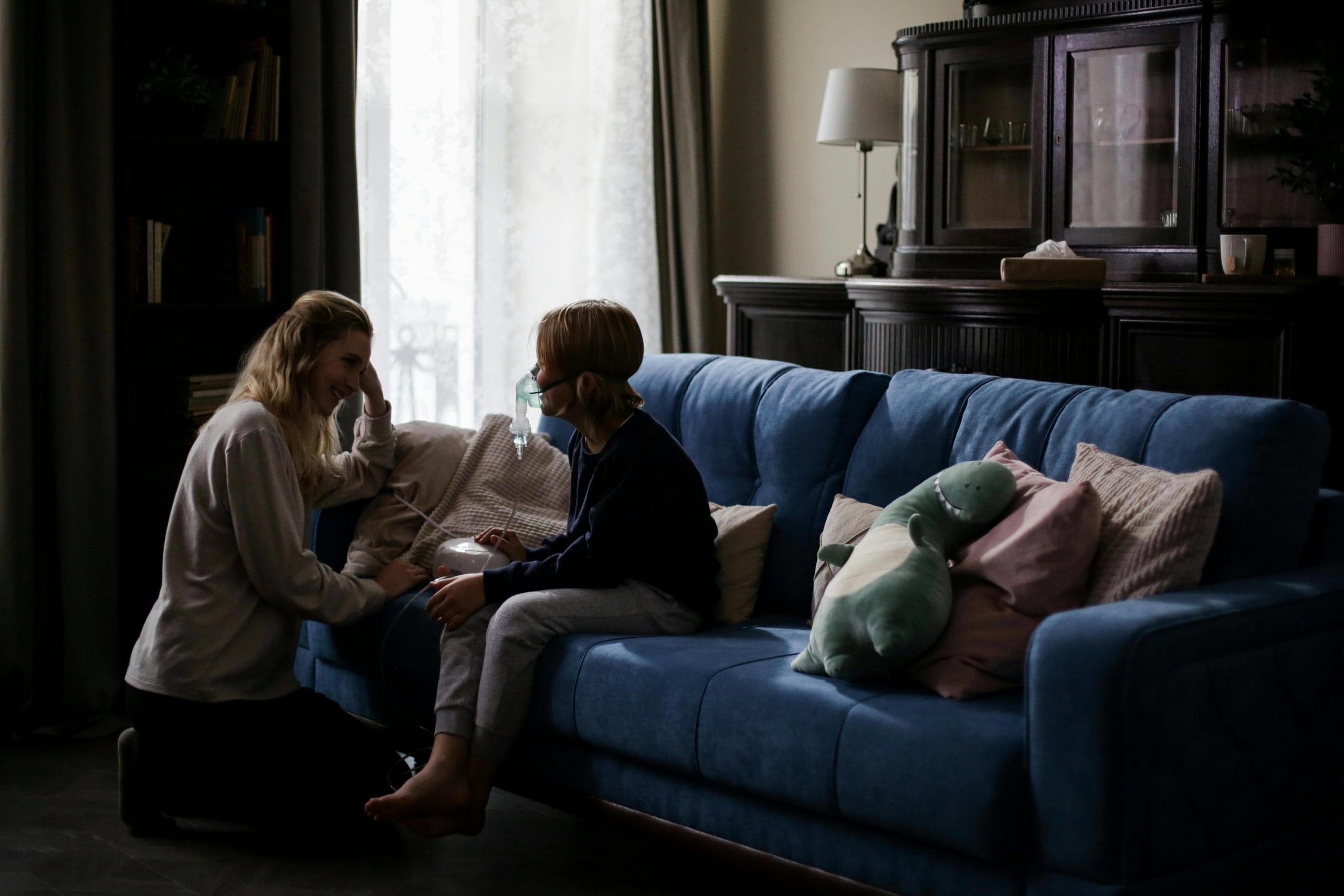 Sick with mother in a sofa