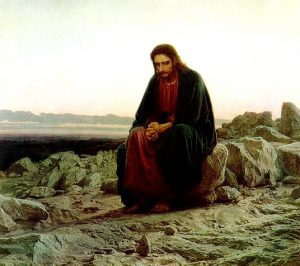 Lent-Y4 An image of a man sitting on a rock.