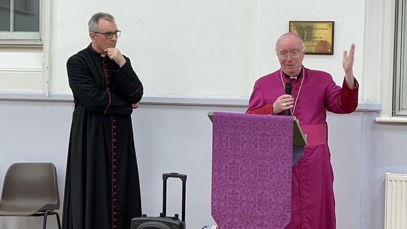 Canon James and Bishop Philip Canon James McAuley listening to Bishop Philip speaking on the launching of the "Cathedral150" project.