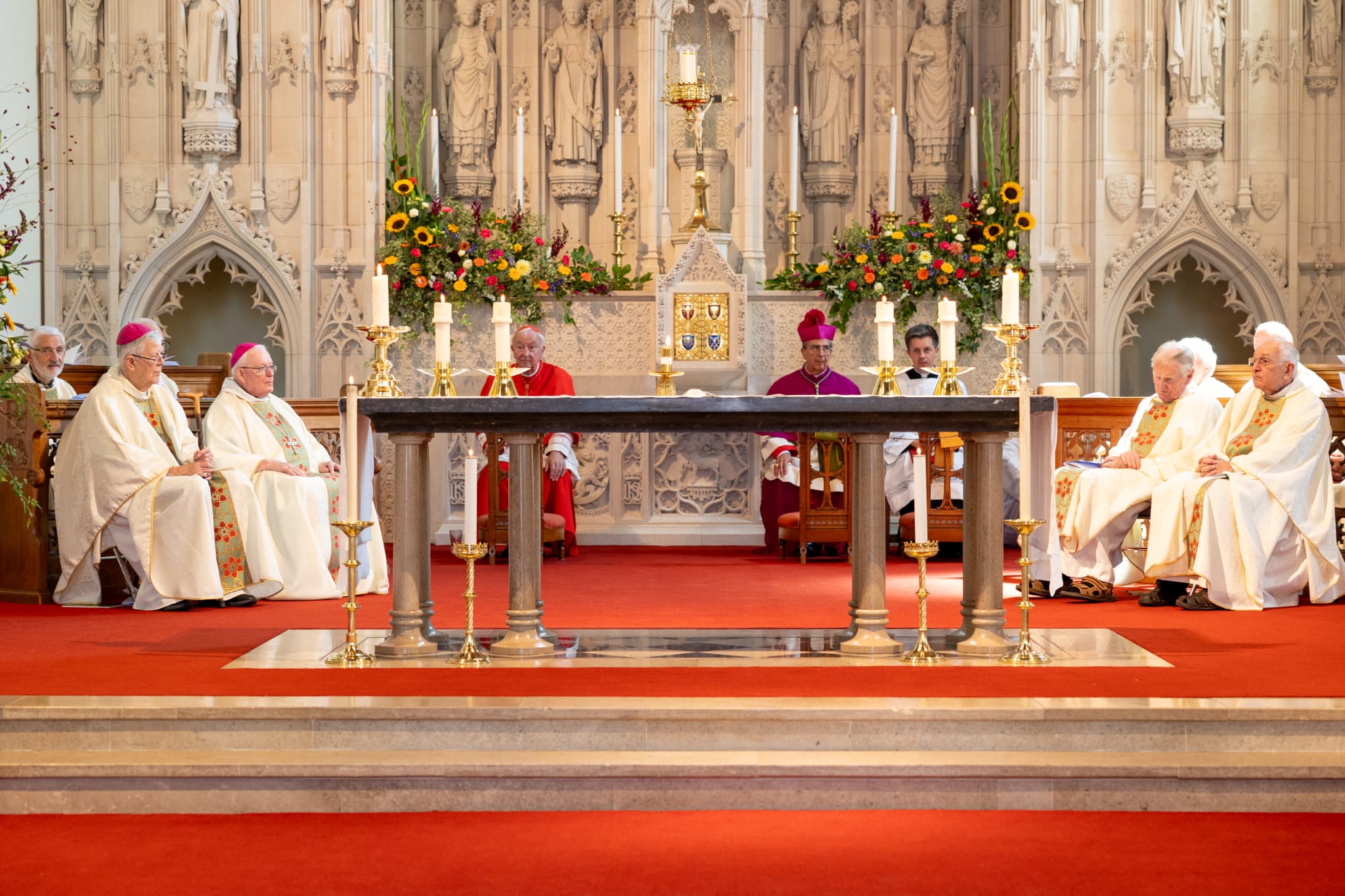 Altar at Winchester Clergy behind altar in St Peter's Winchester. Highlights are Bishop Crispian, the Cardinal for England and Wales and the Papal Nuncio