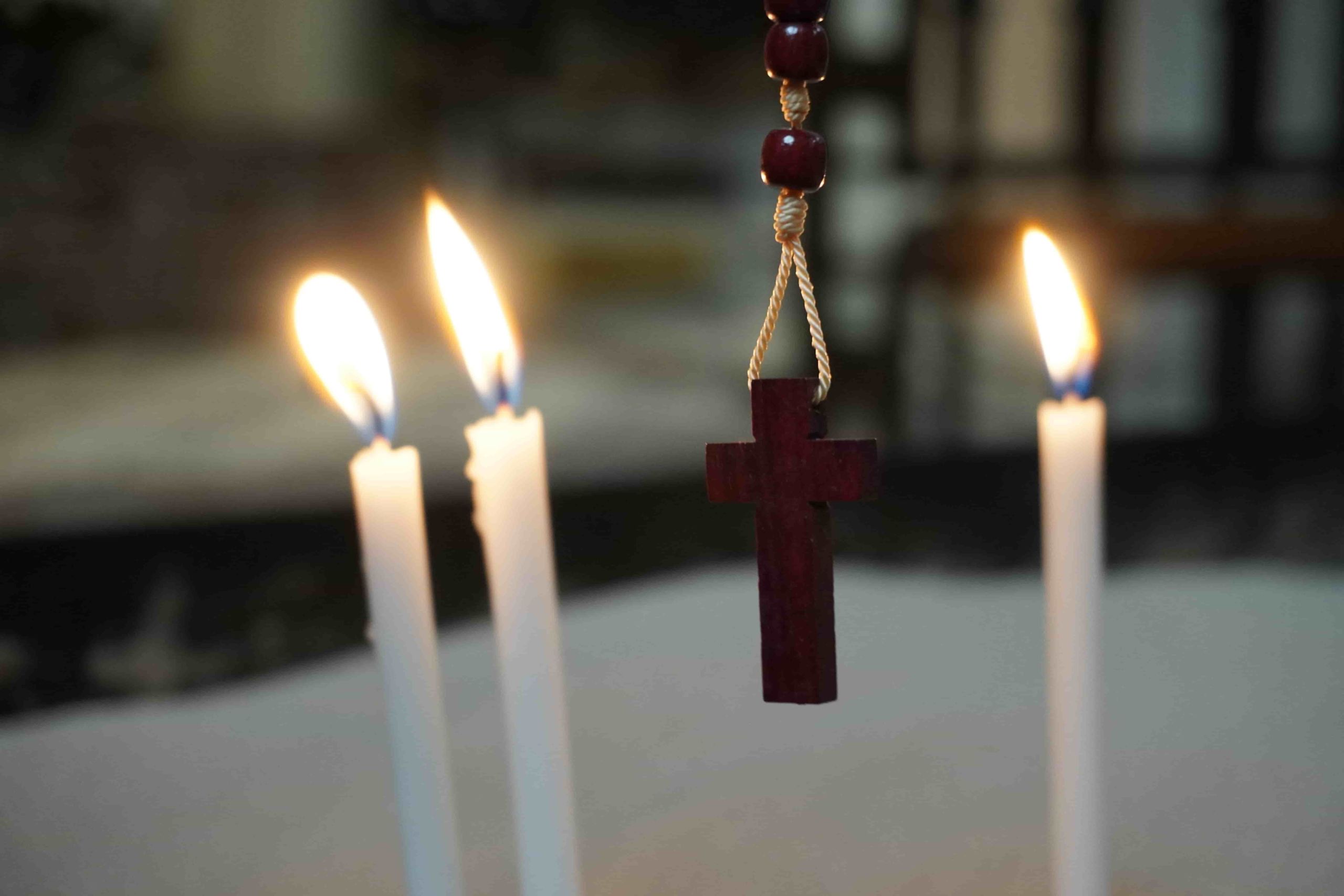 27 – Cross by candles