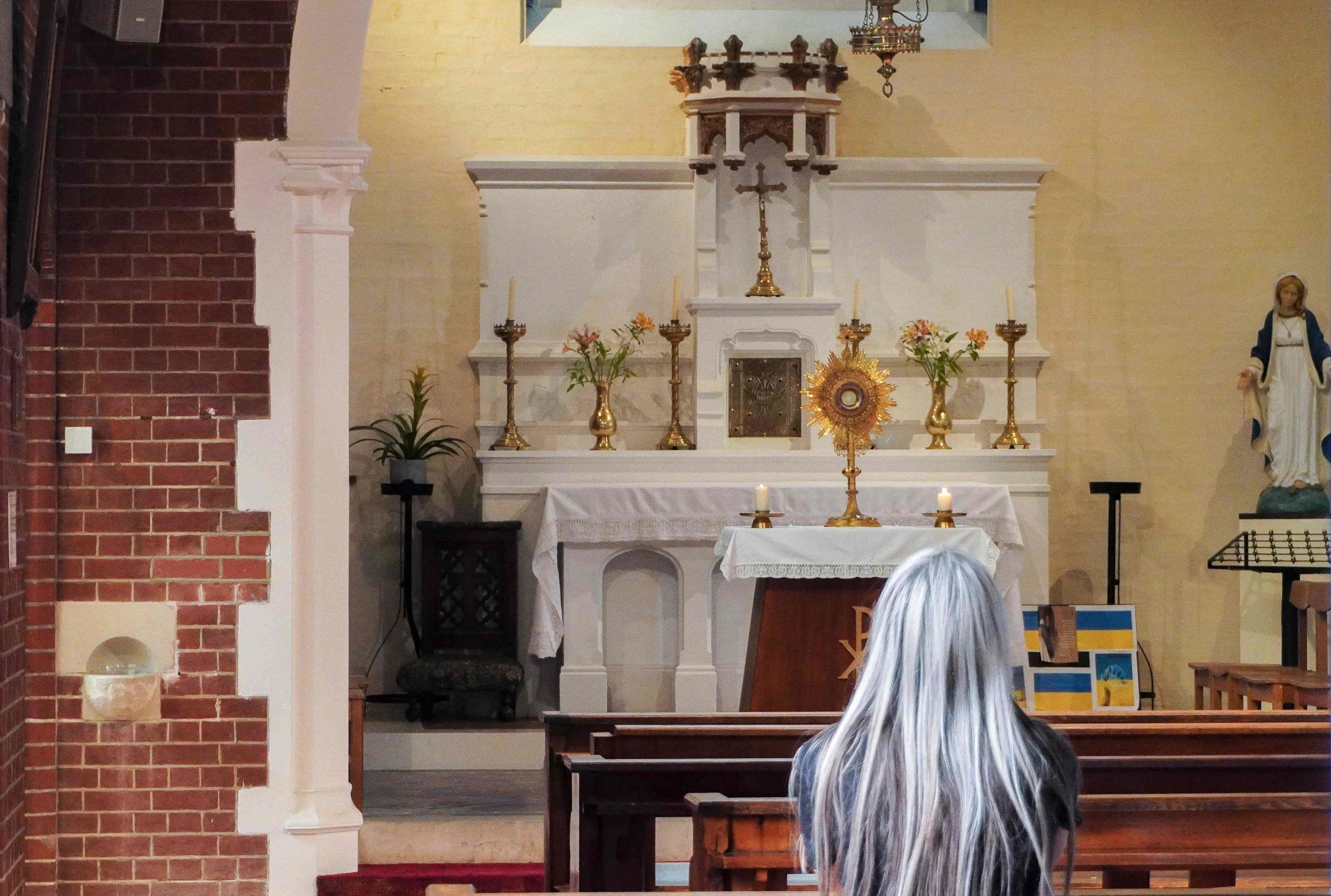 Woman Praying Before the Blessed Sacrament Woman Praying Before the Blessed Sacrament